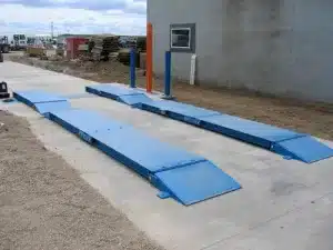 Portable truck axle scale installed outside of a loading site. 